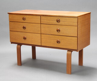 A Schreiber mid-Century teak finished chest of 6 short drawers with countersunk handles, raised on shaped supports 72cm h x 100cm w x 43cm d (The top is slightly warped and has light scratches, water marks and sun bleaching in places) 