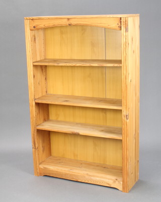 A pine bookcase fitted adjustable shelves 124cm h x 78cm w x 25cm d (ring mark to top)