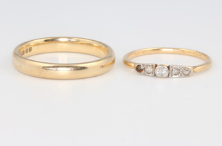 A 9ct yellow gold wedding band size S 1/2, 4 grams and an 18ct yellow gold diamond ring (1 stone missing), size M 1.5 grams