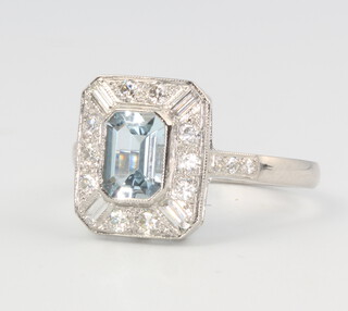 A platinum aquamarine and diamond ring in the Art Deco style, the centre stone approx. 0.75ct, the brilliant and baguette cut diamonds approx. 0.5ct, size O, 5 grams 