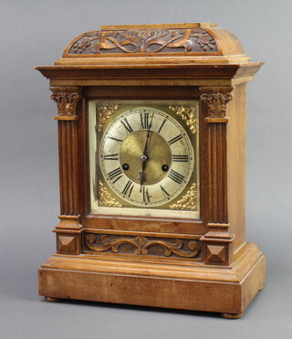 Hamburg American Clock Co. a Victorian 8 day striking bracket clock with gilt dial and silvered chapter ring, Roman numerals, contained in a carved walnut case with columns to the sides complete with pendulum (no key), 39cm h x 29cm w x 17cm d 