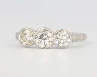 A platinum 3 stone diamond ring with diamond shoulders approx. 1.2ct, size P, 3.8 grams 