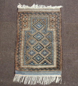 A brown and blue ground Persian prayer rug 110cm x 72cm 
