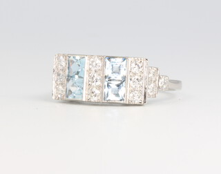 A platinum princess cut aquamarine and diamond ring in the Art Deco style, approx. 4 grams, size O 1/2