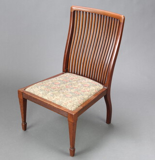 An Edwardian mahogany stick and rail back nursing chair raised on square tapered supports, spade feet 77cm h x 47cm w x 43cm d (seat 32cm x 32cm) 