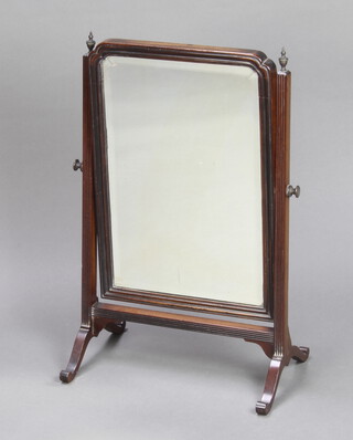 A 19th Century arched bevelled plate dressing table mirror in a mahogany swing frame 62cm h x 39cm w x 25cm d 