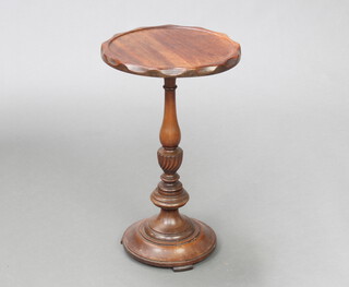 An Edwardian circular Georgian style mahogany wine table with shaped border, raised on spiral turned column and spreading foot 50cm h x 30cm diam. 