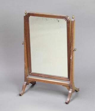 A 19th Century arched plate dressing table mirror contained in a mahogany swing frame 62cm x 39cm x 25cm 