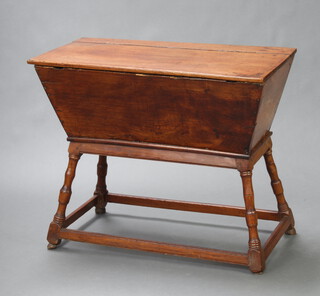 An 18th Century rectangular elm dough proving bin of typical form, raised on turned and block supports 76cm h x 91cm w x 48cm d 