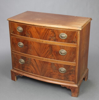 A 1920's Georgian style mahogany bow front chest of 3 drawers raised on bracket feet 74cm h x 79cm w x 43cm d  