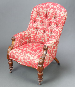 A Victorian mahogany showframe armchair upholstered in buttoned red and grey floral material, raised on turned supports 93cm h x 61cm w x 54cm d (seat 35cm x 40cm)