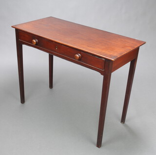 A Georgian mahogany side table fitted a drawer with tore handles, raised on square tapered supports 71cm h x 92cm w x 44cm d 