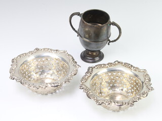 A pair of Edwardian circular silver pierced bon bon dishes Birmingham 1905 together with a 2 handled trophy cup 150 grams 