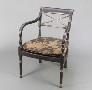 A Regency ebonised and gilt painted bar back open armchair with woven rush seat, raised on turned supports 72cm h x 52cm w x 44cm d (seat 28cm x 33cm) 