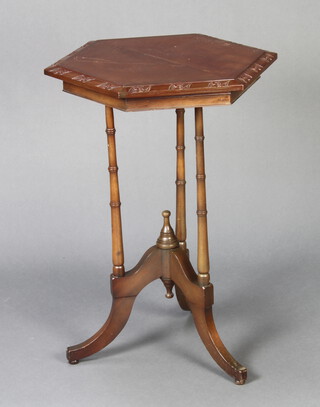 An Edwardian carved walnut hexagonal occasional table raised on turned supports with tripod base 75cm h x 56cm w x 49cm d 