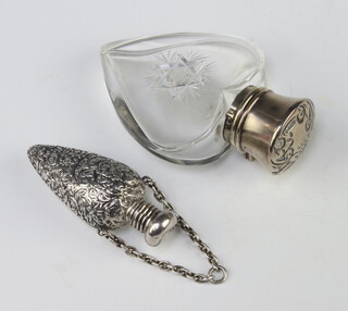 An Edwardian silver mounted heart shaped cut glass scent bottle Birmingham 1907 8cm together with a repousse tapered scent bottle 5cm 