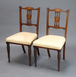 A pair of Victorian inlaid rosewood pierced slat back bedroom chairs with overstuffed seats, raised on turned supports 89cm h x 46cm w x 41cm d (seats 33cm x 35cm) 