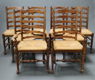 A set of 8 elm ladder back dining chairs with woven rush seats, raised on club supports comprising 2 carvers 106cm h x 50cm w x 59cm d (seat 38cm x 35cm) and 6 standard chairs 99cm h x 39cm w x 48cm d (seat 33cm x 28cm)