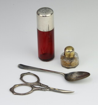 A Victorian silver mounted ruby glass scent bottle London 1883 7cm together with a miniature lidded bottle, spoon and pair of scissors