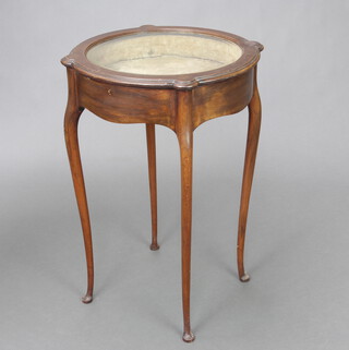An Edwardian circular mahogany Georgian style bijouterie table with plush interior and bevelled glazed top, raised on cabriole supports 72cm h x 47cm diam. 