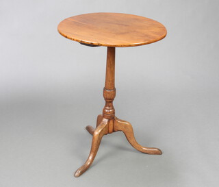 An 18th Century circular elm wine table raised on a turned column and tripod base 68cm h x 48cm diam. 