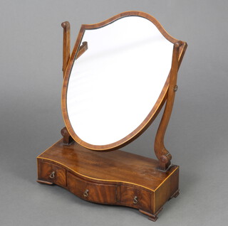 A 19th Century Sheraton style shield shaped dressing table mirror contained in a mahogany frame, the base of serpentine outline with 3 drawers, raised on cabriole supports 60cm h x 43cm w 