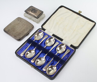 An engine turned silver cigarette case Birmingham 1928, a rectangular glass box with Reynolds angels lid, together with 6 silver tea spoons 170 grams
