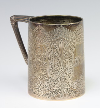 A Victorian silver tapered mug decorated with scrolling flowers and leaves with monogram, London 1882, 158 grams, 9cm 