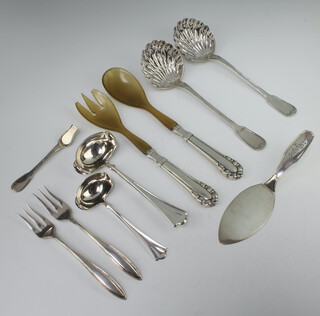 A pair of Continental sifter spoons with shell bowls, 2 sauce ladles, 2 forks, server and spoon together with 2 mounted servers, weighable silver 340 grams 