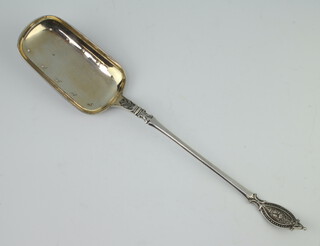 A Danish silver strawberry serving spoon with fancy handle and gilt bowl, the reverse engraved with strawberries 