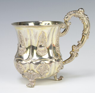 A 19th Century Continental repousse silver baluster mug with fancy scroll handle 233 grams, 13cm 
