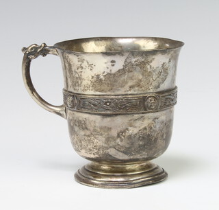 A silver mug with strap work decoration in the Arts & Crafts style, 147 grams, London 1947, 8cm  