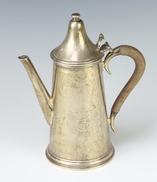 A modern Queen Anne style silver coffee pot with domed lid and fruitwood handle with chased armorial, London 1988, 22cm, 686 grams 