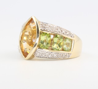 A 9ct yellow gold peridot and gem set ring 5.6 grams, size O 