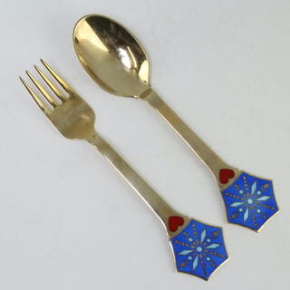 A Michelsen, a sterling silver gilt enamelled spoon and fork 92 grams 