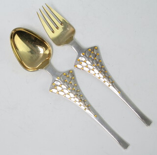 A Michelsen, a sterling silver gilt and enamelled 1965 spoon and fork, 92 grams 
