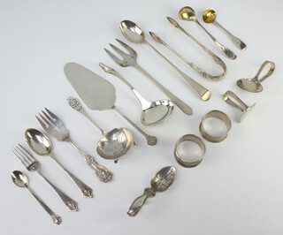 A pair of Scottish silver George III tongs Edinburgh 1819, 9 spoons and napkin rings, 532 grams 