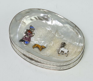 A Continental silver mother of pearl and enamelled oval snuff box decorated with a figure, dog and deer 9cm x 6cm, 172 grams 