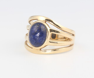 A 9ct yellow gold lapis lazuli open shank ring, size O, 4.9 grams
