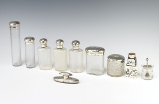An Edwardian silver mounted hair tidy Chester 1905, a ditto mounted glue pot, 6 plated mounted toilet bottles and a silver mounted inkwell together with a nail buffer 