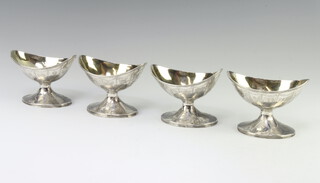 A set of 4 George III silver boat shaped table salts with gilt interiors London 1819, 282 grams 