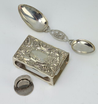 An Edwardian silver menu holder Chester 1909 together with a matchbox holder and double folding spoon 96 grams 