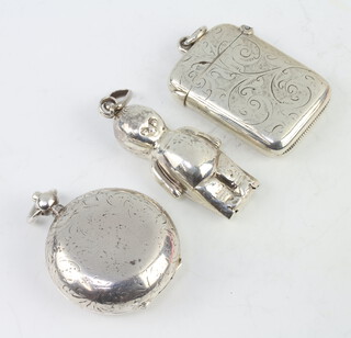 A silver sovereign case Birmingham 1897, a vesta and baby rattle 54 grams 