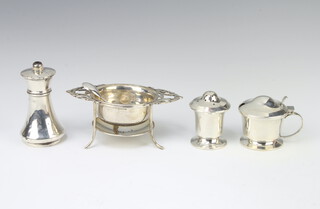 A silver tea strainer and stand Birmingham 1912, 3 condiments 178 grams