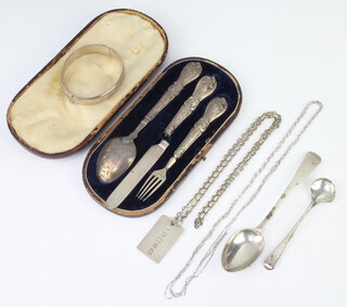 A 1977 silver ingot on a silver chain, a cased christening set and minor cutlery 106 grams 