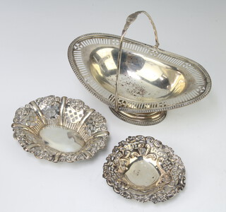 An Edwardian silver swing handled basket 16cm and 2 bon bon dishes, rubbed marks 194 grams  