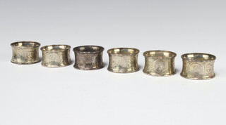 A set of 6 Victorian silver napkin rings with engraved floral decoration Birmingham 1873, 90 grams