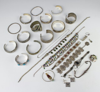 A collection of minor European and middle Eastern white metal bangles an dother costume jewellery