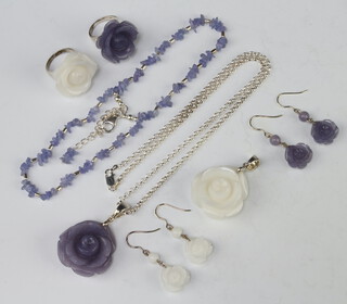 A silver mounted hardstone pendant, ring and earrings, a ditto ring, pendant, bracelet and earrings