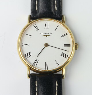 A gentleman's gilt cased Longines wristwatch on a leather strap 